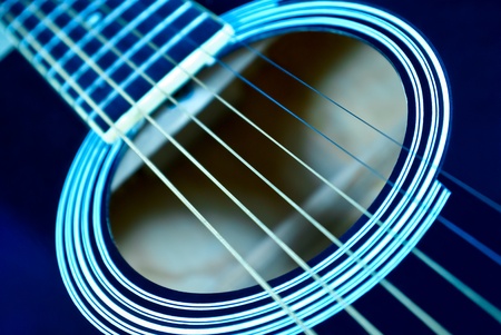 Guitar side view, strings and fingerboard with a shallow depth of fieldの写真素材