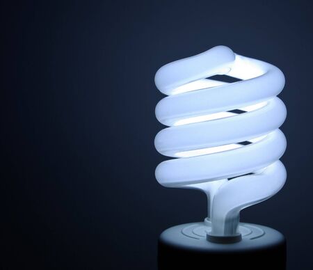 A florescent bulb symbolizing the saving energy of and moneyの写真素材