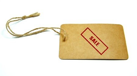 "sale" written on a tag tied with a brown string isolated on a white backgroundの写真素材