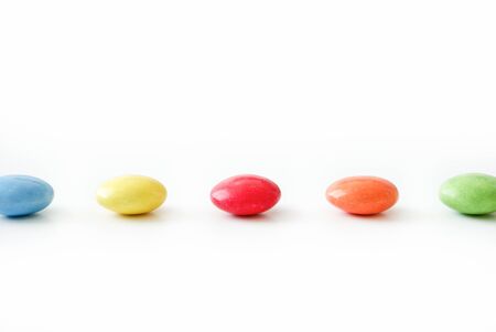 Colorful dragees assorted on a white backgroundの写真素材