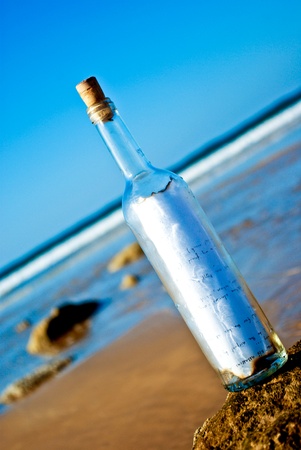 Message in a Bottle at a deserted beachの写真素材