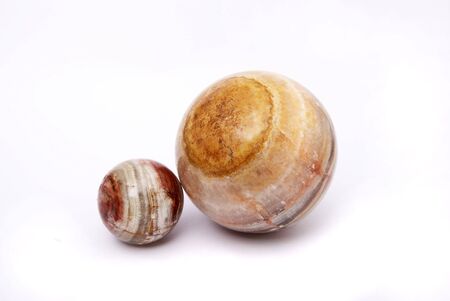 Two spheres from a greenstone on a white backgroundの写真素材