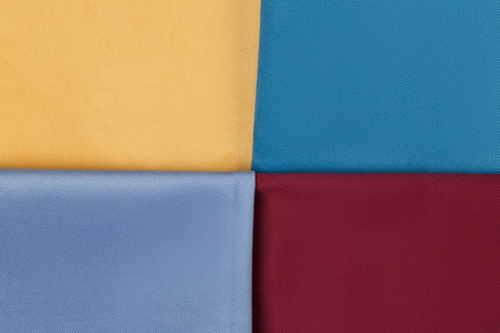 Fabric neatly folded, laid out with different patterns for desigの写真素材