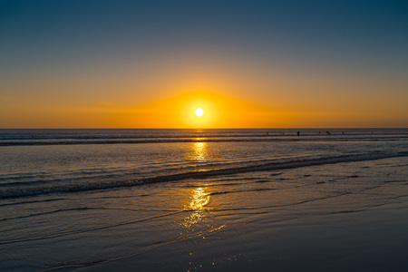 Sunset on the tropical beach. Cuta beach on Bali island. Indonesの写真素材