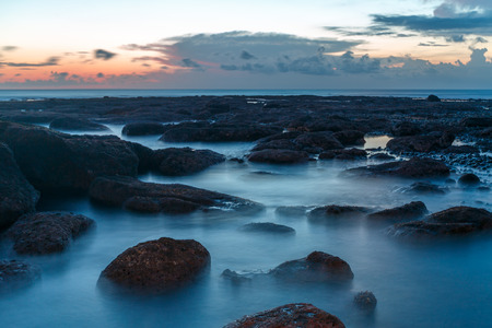 long exposure shooting of small island and rock and soft sea water with blue sky, Sky burst, blurred motionの写真素材