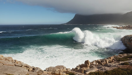 Waves crashing on the rocks in Cape Town, South Africa.の素材