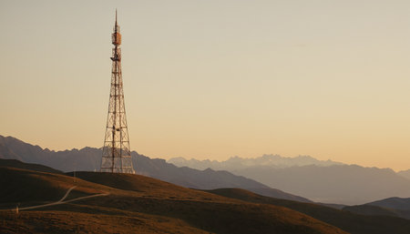 Telecommunication tower at sunset in the mountains of Kyrgyzstanの素材