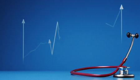 Stethoscope and graph on blue background. Health care concept.の素材