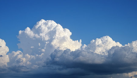 Blue sky background with white fluffy clouds. Cumulus white clouds.の素材