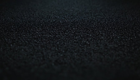Black glitter texture abstract background. Macro shot with shallow depth of field.の素材