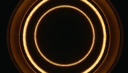 Circle with yellow light on black background. Close-up.の素材