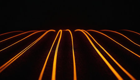 A closeup shot of a black background with orange lines and wavesの素材