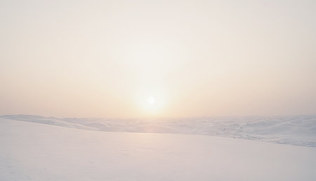 Sunset over the snow-covered field. Beautiful winter landscape.の素材