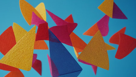 Colorful origami paper airplanes flying on blue background, close upの素材