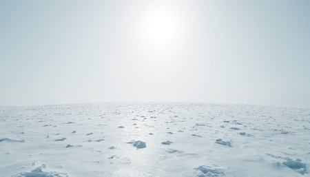Beautiful winter landscape with snowdrift and sun in the skyの素材