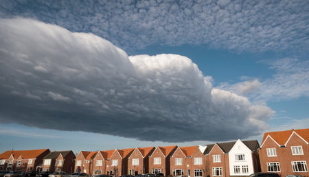 Clouds over a row of houses in the north of Denmark.の素材