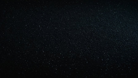 Abstract black background with glitter and sparkles. Texture for design.の素材