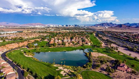 Aerial view of golf course and cityscape in Nevada, USAの素材