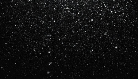 Snowfall on a black background. Snowflakes on a black background.の素材