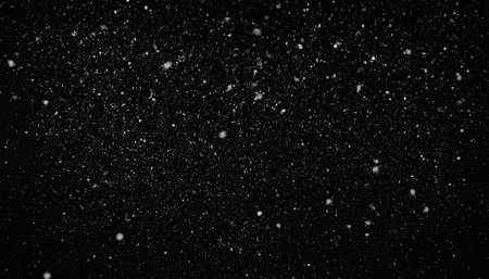 Snowfall on black background. Snowflakes on a black backgroundの素材