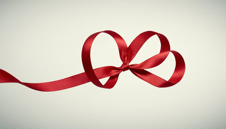 Heart shaped red ribbon on white background. Valentines day concept.の素材