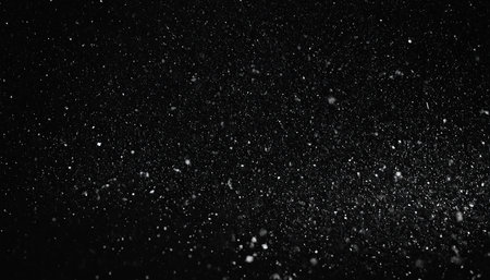 Snowfall on a black background. Snowflakes on a black background.の素材