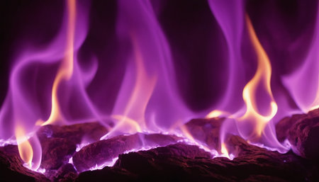 Close-up of a fire in a fireplace with a purple backgroundの素材