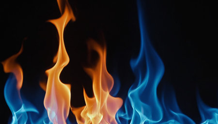Fire flames isolated on black background with copy space for your text.の素材