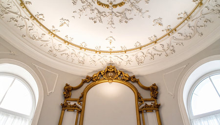 Luxury interior of an old building with white walls and gold ornamentsの素材