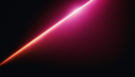 abstract red light rays on a black background with copy space.の素材