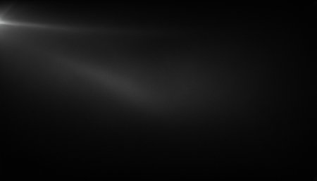 Real Lens Flare Shot in Studio over Black Background. Easy to add as Overlay or Screen Filter.の素材