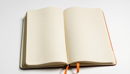 Blank note book with orange bookmark isolated on a white background.の素材