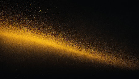 Gold dust on a black background. Abstract golden dust on a black background.の素材