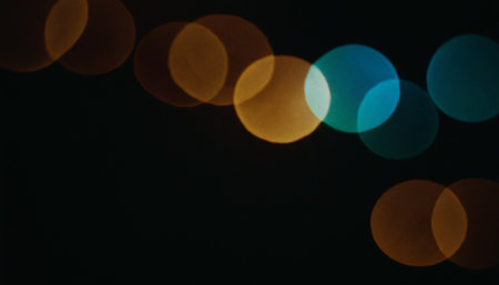 Abstract circular bokeh background of Christmaslight on black background.の素材
