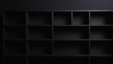 Empty black bookshelf on black wall background. 3d renderingの素材