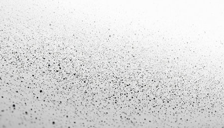 Black particles on a white background. Abstract black and white background.の素材