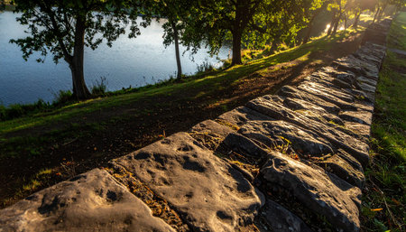 Stone walkway in the park at sunset, beautiful photo digital pictureの素材