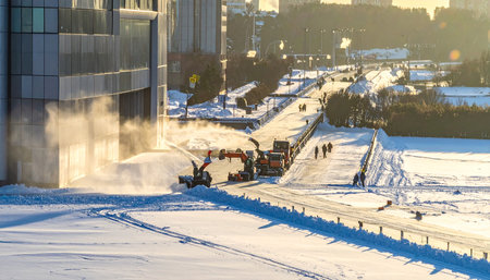 Workers remove snow from the streets of Warsaw.の素材