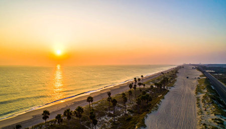 Aerial view of beautiful beach and sea at sunset time for travel and vacationの素材