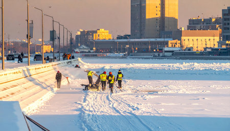 Workers clean snow from the street.の素材