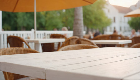 Empty wooden table and chair in outdoor cafe or restaurant, shallow depth of fieldの素材