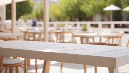 Empty table and chairs in outdoor cafe with bokeh background.の素材