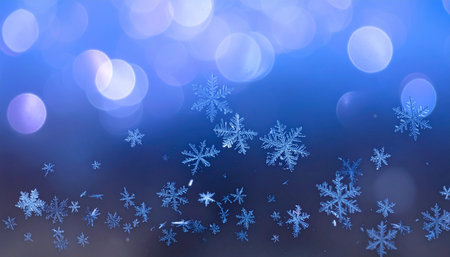 snowflakes on blue bokeh background. christmas backgroundの素材