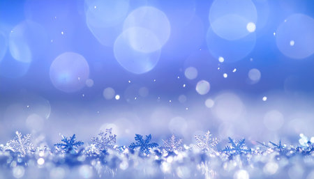 Christmas background with snowflakes on blue bokeh background.の素材