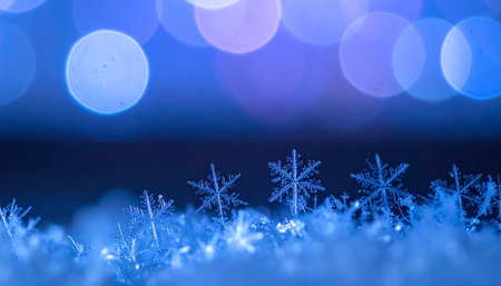 Snowflakes in the snow on a blue bokeh backgroundの素材