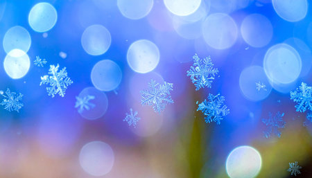 Snowflakes on blue bokeh background. Christmas background.の素材