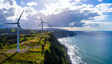 Aerial view of wind turbines on a hillside in Azoresの素材