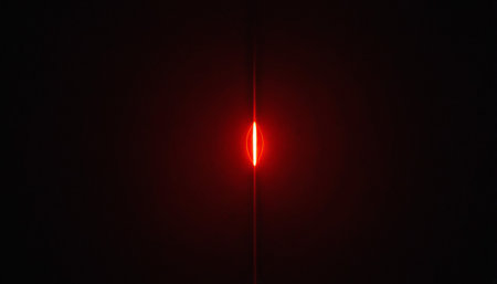 red light on a black background, close-up, red light from the lampの素材