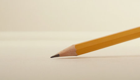Close up of a pencil on white background. Shallow depth of field.の素材