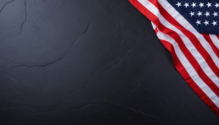 American flag on black stone background. Top view with copy space.の素材